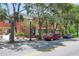 Inviting brick building featuring mature trees, and prominent signage at 5742 Meadowlane St, New Port Richey, FL 34652