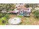 Aerial view of the property showcasing the pool, patio, and backyard at 12529 Shadow Ridge Blvd, Hudson, FL 34669