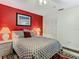 Comfortable bedroom with a ceiling fan, bedside tables, and wall art at 12529 Shadow Ridge Blvd, Hudson, FL 34669