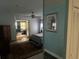 Spacious bedroom featuring a ceiling fan, an adjacent living area with a sofa, and ample closet space at 12529 Shadow Ridge Blvd, Hudson, FL 34669