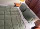 A cozy bedroom with a nicely made bed, side tables, and comfortable pillows at 12529 Shadow Ridge Blvd, Hudson, FL 34669