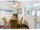 Dining area with a glass table and views to the front door at 12529 Shadow Ridge Blvd, Hudson, FL 34669