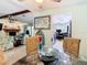 Open-concept dining area flows into the living room with views of the fireplace and kitchen at 12529 Shadow Ridge Blvd, Hudson, FL 34669