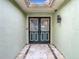 Inviting front double door features decorative glass, black hardware and sidelights at 12529 Shadow Ridge Blvd, Hudson, FL 34669