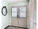 Interior view of the decorative double door with glass inserts and a closet at 12529 Shadow Ridge Blvd, Hudson, FL 34669