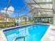 Enjoy swimming laps in the screened pool at 12529 Shadow Ridge Blvd, Hudson, FL 34669