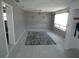 Spacious bedroom features neutral walls, a ceiling fan, and large window, providing a serene and comfortable space at 13618 Stacey Dr, Hudson, FL 34667