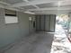 Spacious carport offers covered parking with a partially enclosed design and easy access to the home's side entrance at 13618 Stacey Dr, Hudson, FL 34667