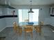 Well-lit dining room featuring a neutral color scheme, functional layout with a full view of its sliding glass doors at 13618 Stacey Dr, Hudson, FL 34667