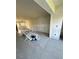 Spacious living room features neutral tile flooring, and ample natural light from windows at 4515 Marine Pkwy # 102, New Port Richey, FL 34652