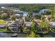 Overhead view of waterfront homes with docks, boats, and lush landscaping along a tranquil canal setting at 8142 River Point Dr, Weeki Wachee, FL 34607