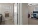 Bright bathroom featuring tile flooring, granite countertops, and a window with natural light at 13822 Bee Tree Ct, Hudson, FL 34669