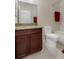 Bathroom features a granite vanity, toilet, and tub with shower at 13822 Bee Tree Ct, Hudson, FL 34669