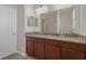 Bathroom featuring granite countertops, a double sink, and a glass enclosed shower at 13822 Bee Tree Ct, Hudson, FL 34669