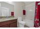Bathroom features a granite vanity, toilet, and tub with shower at 13822 Bee Tree Ct, Hudson, FL 34669