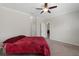 Spacious bedroom features a ceiling fan, neutral walls, and carpet flooring at 13822 Bee Tree Ct, Hudson, FL 34669