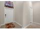 Inviting neutral-colored foyer, tile floor, and adjacent hall at 13822 Bee Tree Ct, Hudson, FL 34669