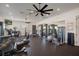 Bright and spacious gym equipped with various weight and cardio machines, plus a large mirror at 13822 Bee Tree Ct, Hudson, FL 34669