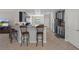 Modern kitchen featuring granite counters, stainless steel appliances, and a breakfast bar with seating at 13822 Bee Tree Ct, Hudson, FL 34669