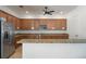 Stylish kitchen featuring stainless steel appliances, granite countertops, and ample cabinet space at 13822 Bee Tree Ct, Hudson, FL 34669