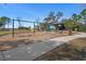 Community playground with swings, slide, and picnic area surrounded by lush greenery and trees at 13822 Bee Tree Ct, Hudson, FL 34669