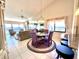 Open-concept living room with tile floors, vaulted ceilings, and water views at 4620 Bay Blvd # 1158, Port Richey, FL 34668