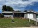 Charming single-story home featuring a well-manicured lawn and fresh exterior paint at 7207 Nova Scotia Dr, Port Richey, FL 34668