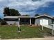 Well-maintained single-story home with attached garage and manicured front yard at 7207 Nova Scotia Dr, Port Richey, FL 34668