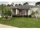 Charming single story home featuring a well-maintained lawn and attractive landscaping at 8111 Merrimac Dr, Port Richey, FL 34668