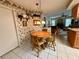 Kitchen with a table and chairs with view into the living room at 8111 Merrimac Dr, Port Richey, FL 34668