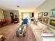 Spacious living room features a neutral color palette and comfortable furnishings at 8111 Merrimac Dr, Port Richey, FL 34668
