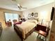 Relaxing main bedroom with a comfortable bed, soft lighting, and tasteful decor at 8111 Merrimac Dr, Port Richey, FL 34668