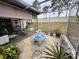 Enclosed patio area boasting a beautiful fountain feature surrounded by potted plants at 8111 Merrimac Dr, Port Richey, FL 34668