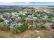 Aerial view of the home and neighborhood, surrounded by lush greenery at 9617 Norchester Cir, Tampa, FL 33647
