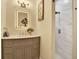 Bathroom vanity with gray cabinets, countertop, and a backlit mirror at 9617 Norchester Cir, Tampa, FL 33647