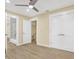 Neutral bedroom with a ceiling fan, closet, and a view of a bathroom at 9617 Norchester Cir, Tampa, FL 33647