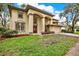 Stunning two-story home with elegant architectural detailing and a well-manicured lawn at 9617 Norchester Cir, Tampa, FL 33647