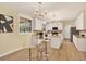 Newly renovated kitchen with white cabinets, center island, stainless steel appliances, and modern lighting at 9617 Norchester Cir, Tampa, FL 33647