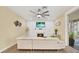 Bright living room with fireplace, ceiling fan, and modern decor at 9617 Norchester Cir, Tampa, FL 33647