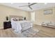Spacious main bedroom with plush carpet, neutral color scheme, and ensuite bathroom access at 9617 Norchester Cir, Tampa, FL 33647