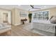 Sun-drenched main bedroom with large windows overlooking the backyard and a neutral color palette at 9617 Norchester Cir, Tampa, FL 33647
