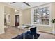 Bright office space featuring a large window and neutral decor at 9617 Norchester Cir, Tampa, FL 33647