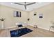 Home office with modern furniture, bright lighting, and neutral wall colors at 9617 Norchester Cir, Tampa, FL 33647