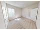 Neutral bedroom with natural light and two doors accessing a closet or bathroom at 10126 Zennia Ln, Parrish, FL 34219