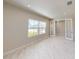 Bright bedroom with large windows and access to additional space through double doors at 10126 Zennia Ln, Parrish, FL 34219