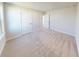 Spacious bedroom showcasing a neutral color palette, soft carpeting, and ample natural light at 10126 Zennia Ln, Parrish, FL 34219