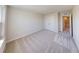 Inviting bedroom with soft carpeting and view into an adjacent bathroom, perfect for relaxation at 10126 Zennia Ln, Parrish, FL 34219