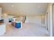 Spacious living area featuring a modern kitchen with a large island and stainless steel appliances at 10126 Zennia Ln, Parrish, FL 34219