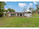Charming single-story home with a well-manicured lawn, stone accents and an inviting driveway at 10200 Sunburst Ct, Spring Hill, FL 34608