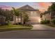 Charming two-story home with a well-manicured lawn and lovely landscaping at 12307 Duckett Ct, Spring Hill, FL 34610